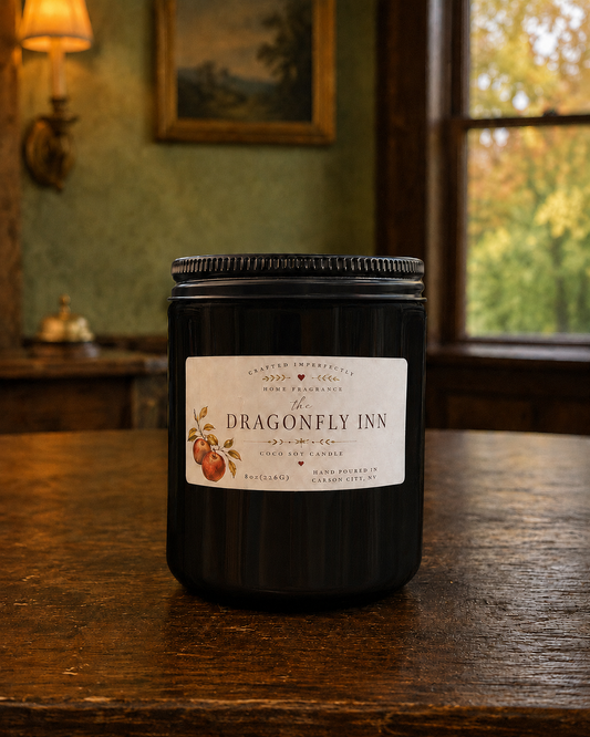 The Dragonfly Inn apple candle in a cozy New England inn setting